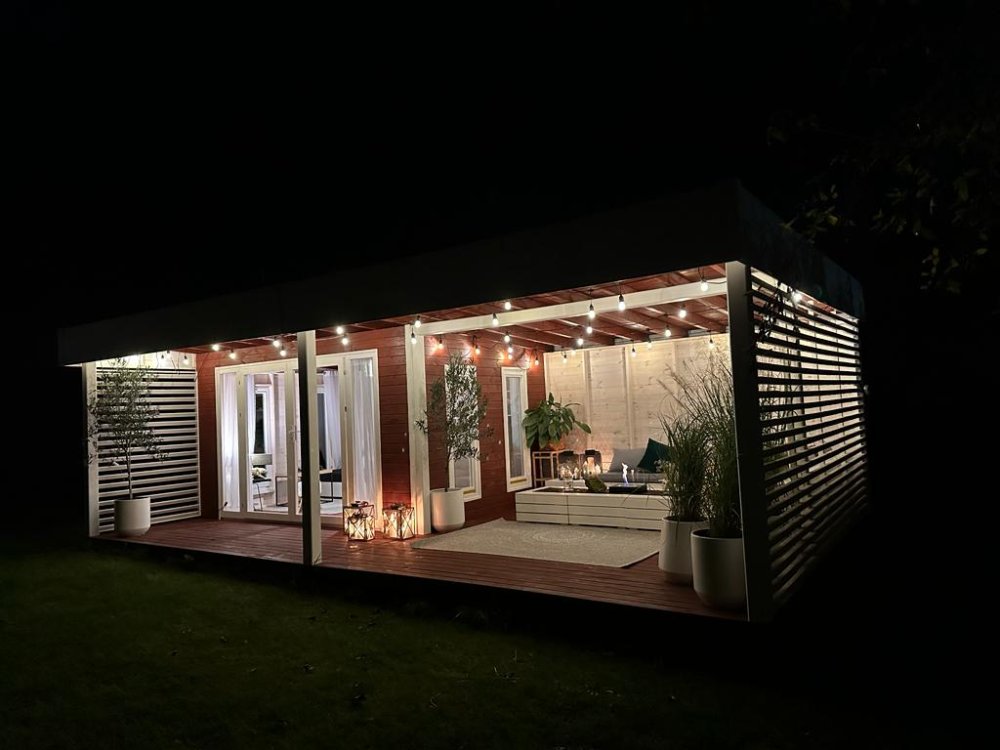 Garden House Cambridge modern wooden garden house in the garden at night