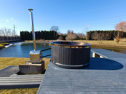 200 cm acrylic round hot tub with external stainless steel wood-fired heater, landscape side view