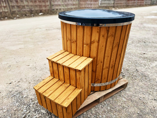Fiberglass cold plunge tub with wooden steps, thermo lid and stainless steel bands, side view
